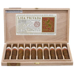 Open wooden box of Liga Privada cigars with cigars inside on a white background